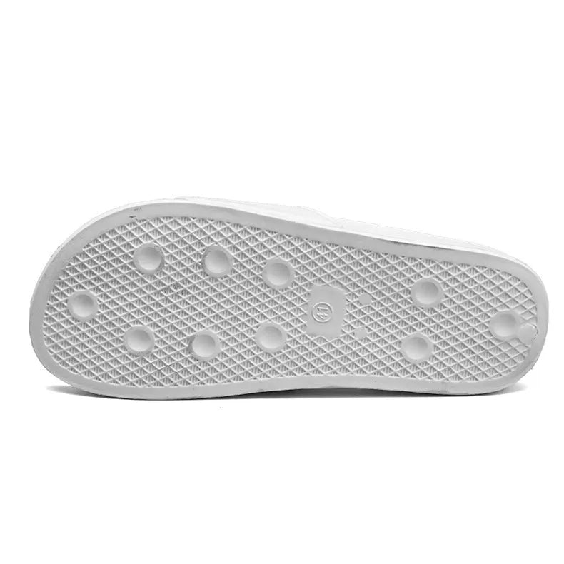 A pair of large men's open-toe slippers with a rubber sole, shown in black.