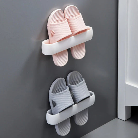 Wall-mounted bathroom slippers in pink, blue, and grey, made from 100% new plastic materials