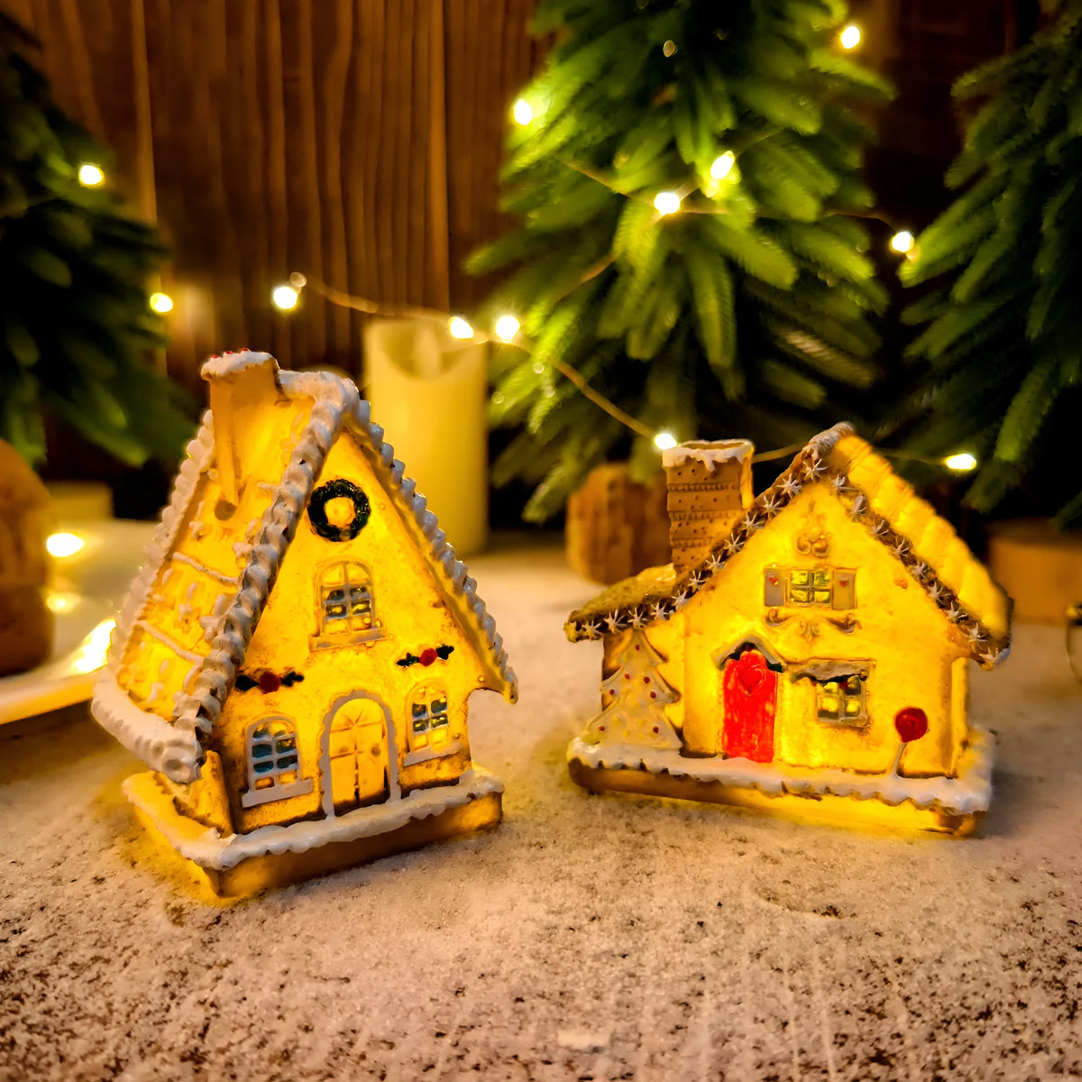 Christmas resin small house micro landscape with warm LED glow on tabletop