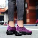 Women's air cushion walking shoes with breathable mesh upper, available in black, purple, grey, dark blue