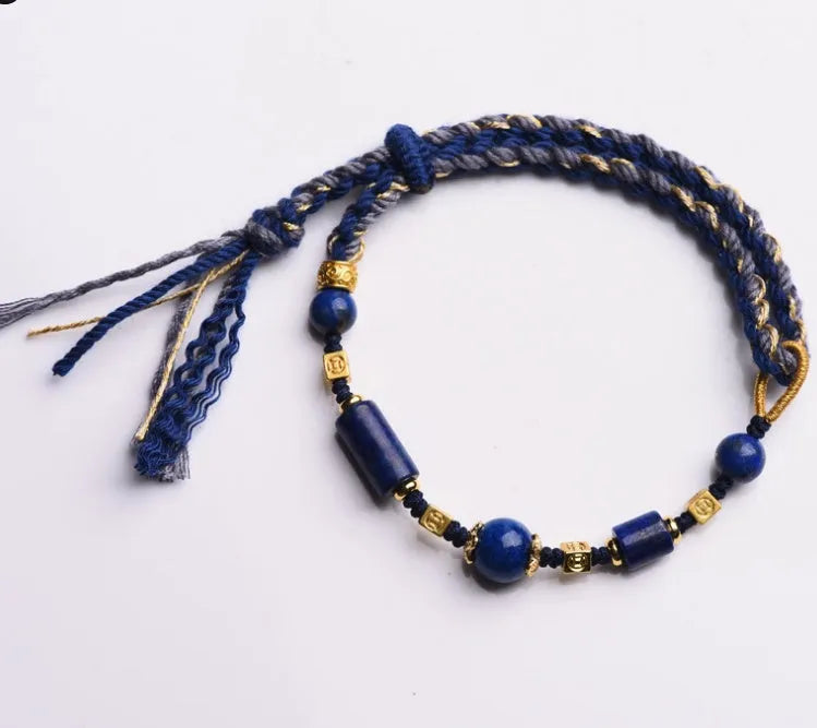 Close-up of a hand-woven flexible wire watch band in Lapis Lazuli blue colour.