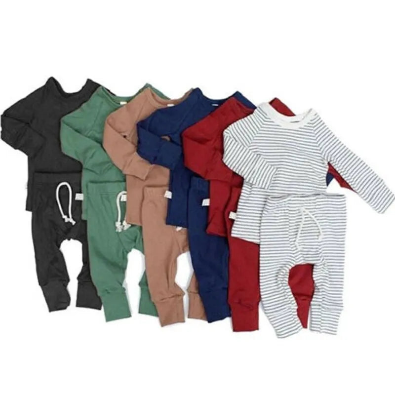 Blue cotton baby tracksuit romper set with cartoon pattern, shown on a hanger.