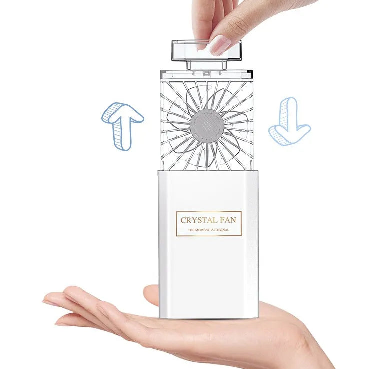 Pink perfume fan with USB charging port and compact design for personal fragrance diffusion