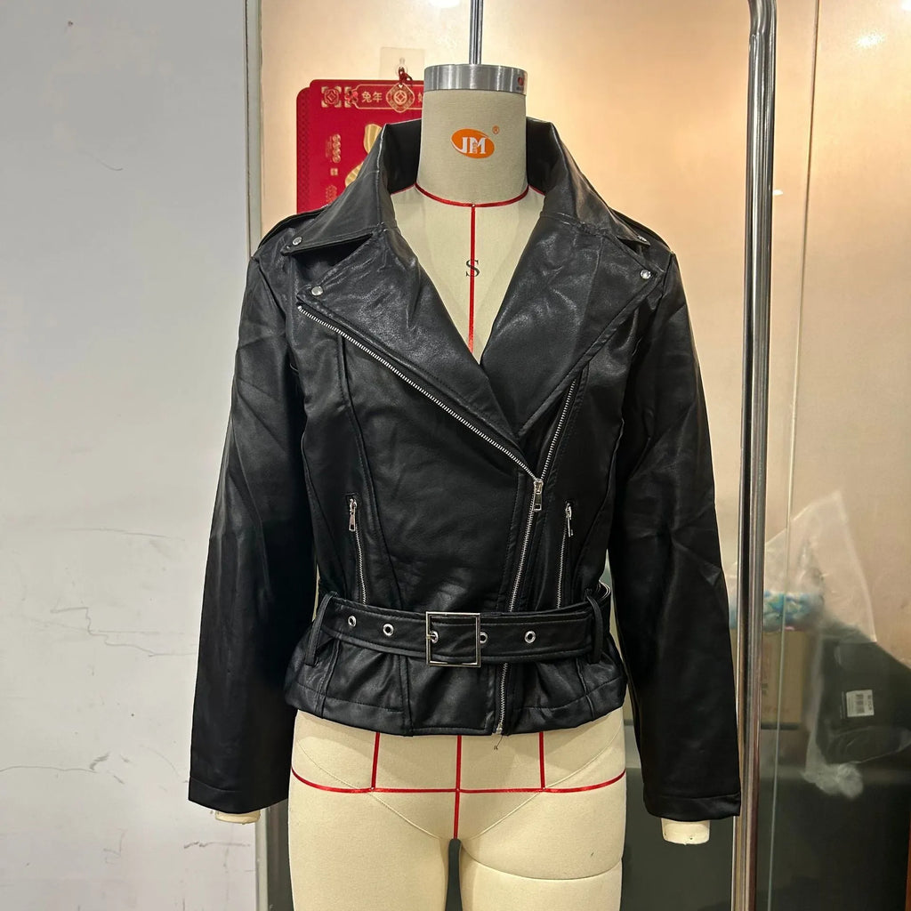 Punk style short jacket with Peter Pan collar and drawstring waist in black leather-look fabric.