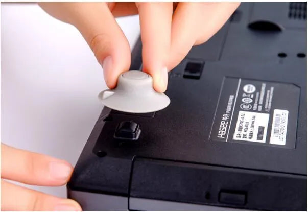 Grey durable plastic laptop cooling pad kit with two large and two small non-slip pads.