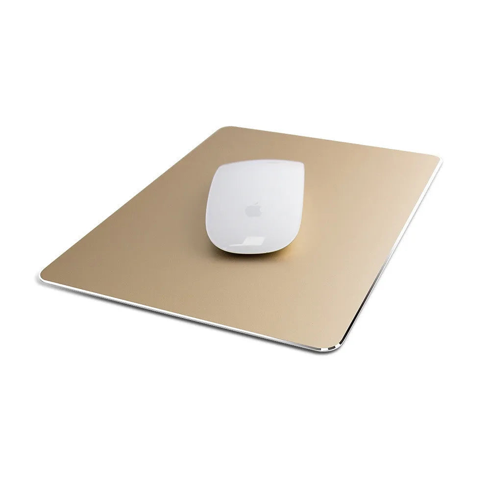 Double-sided aluminium mouse pad in black with non-slip base on a desk