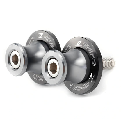 Pair of 8mm CNC aluminium swingarm spools sliders in titanium for Kawasaki Z650 Z900, with Delrin contact and stainless bolts