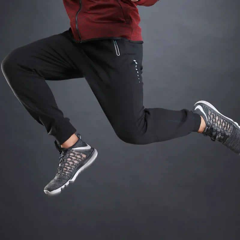 Grey and Royal Blue polyester fitness trousers with elastic waist for training and casual wear