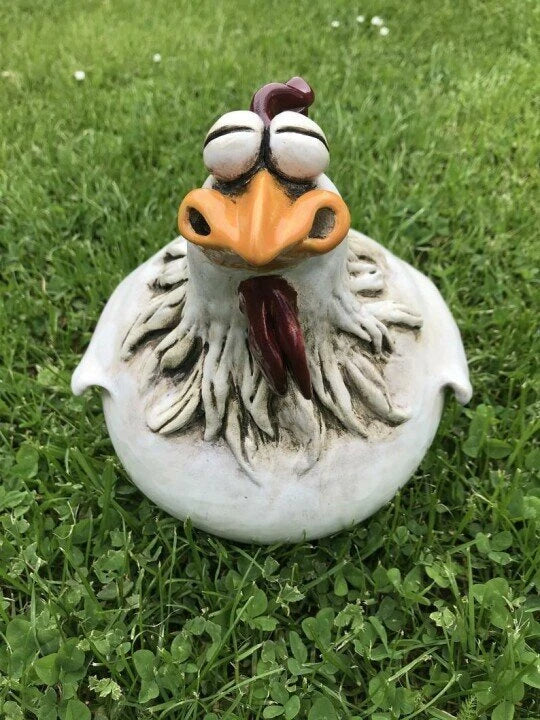 Vibrant resin chicken garden decor with comical expressions, adding a touch of Kiwi charm to outdoor spaces