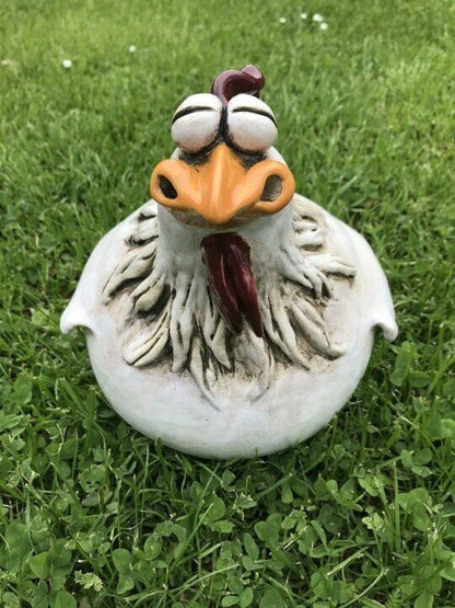 Vibrant resin chicken garden decor with comical expressions, adding a touch of Kiwi charm to outdoor spaces