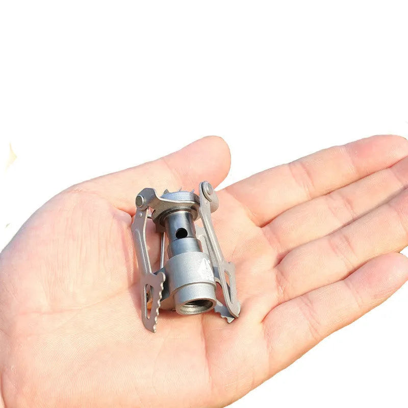 Single-piece portable propane gas camping stove for outdoor use.
