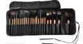 24 professional makeup brushes with wooden handles in a black PU carrying case