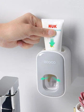 Wall-mounted automatic toothpaste dispenser with upside-down mouthwash cup for convenient and hygienic bathroom organization