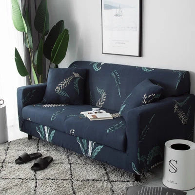 Printed stretchable sofa slipcover covering a three-seater sofa in a modern geometric pattern