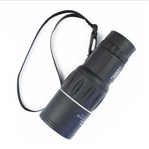 Black 16x52 monocular with large objective lens, shown with focus wheel and BAK4 roof prism optical design.