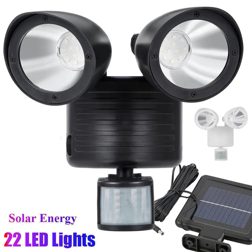 Black and white solar security spotlight with dual motion sensors for outdoor use
