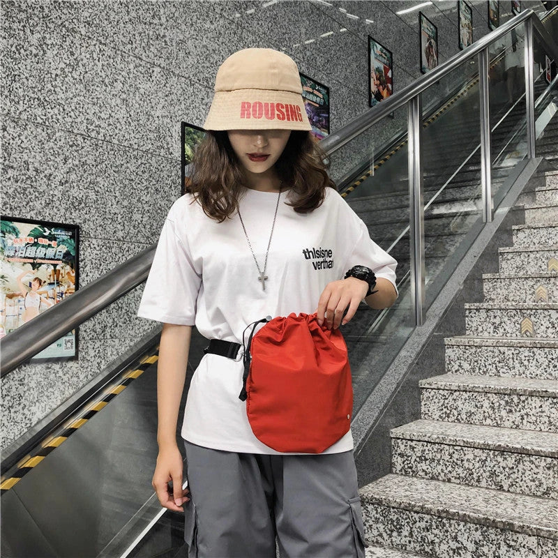Diagonal Drawstring Fabric Waist Bag in Light Grey, Orange, and Black