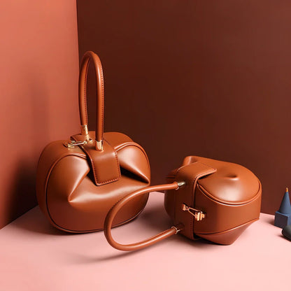 Women's cowhide leather tote bag in tramp shape with single handle and buckle, available in apricot, black, and other colours, big size 35cm x 40cm