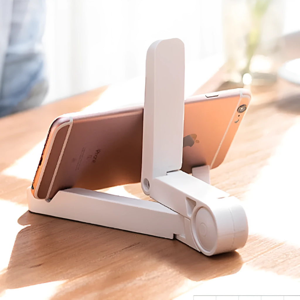 Black foldable tablet holder supporting a tablet in landscape viewing position on a desk