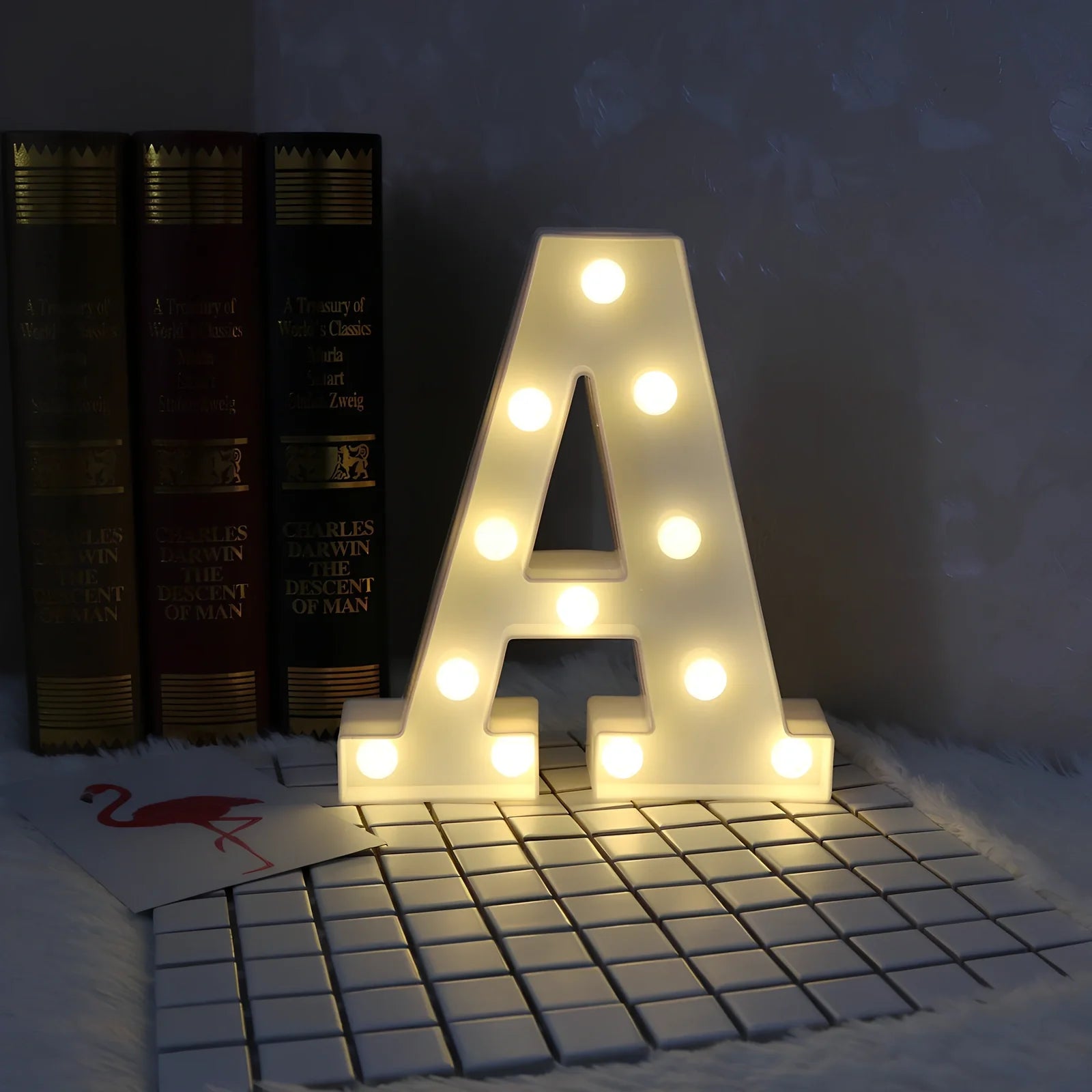 White plastic LED alphabet marquee sign with warm white illumination, 22cm height with battery operation