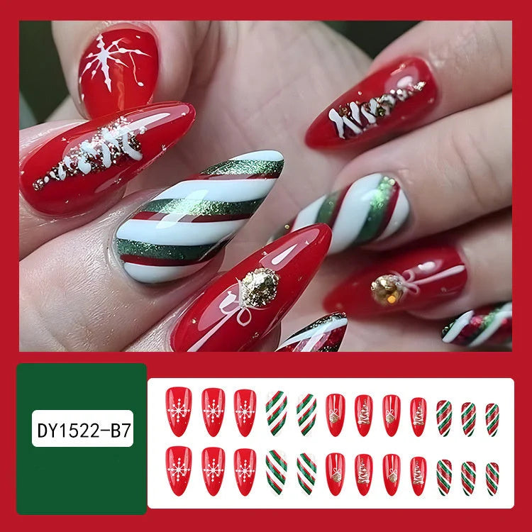Christmas false nails with festive hat, striped, and snowflake designs for holiday parties