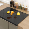 Black transparent acrylic chopping board on a kitchen worktop, available in three sizes up to 45x32cm