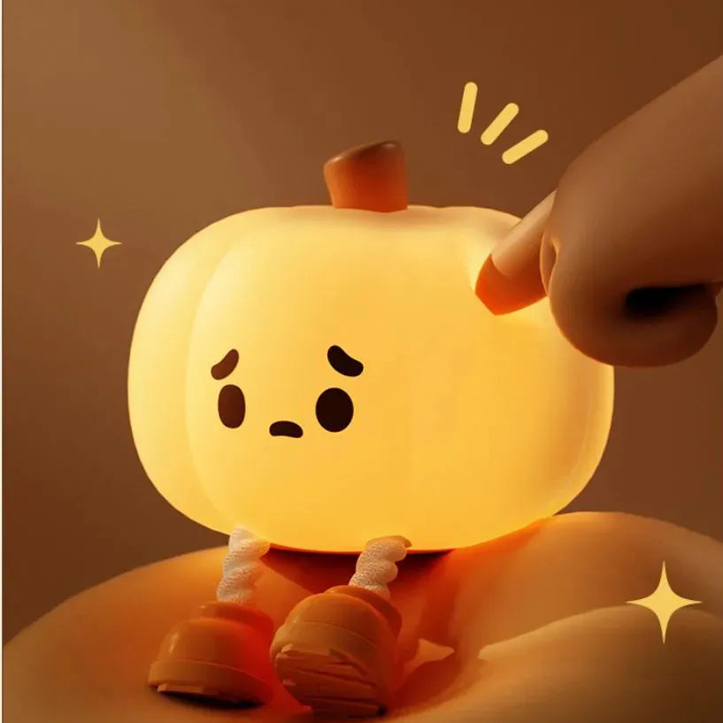 Soft silicone pumpkin night light with touch controls and warm LED glow