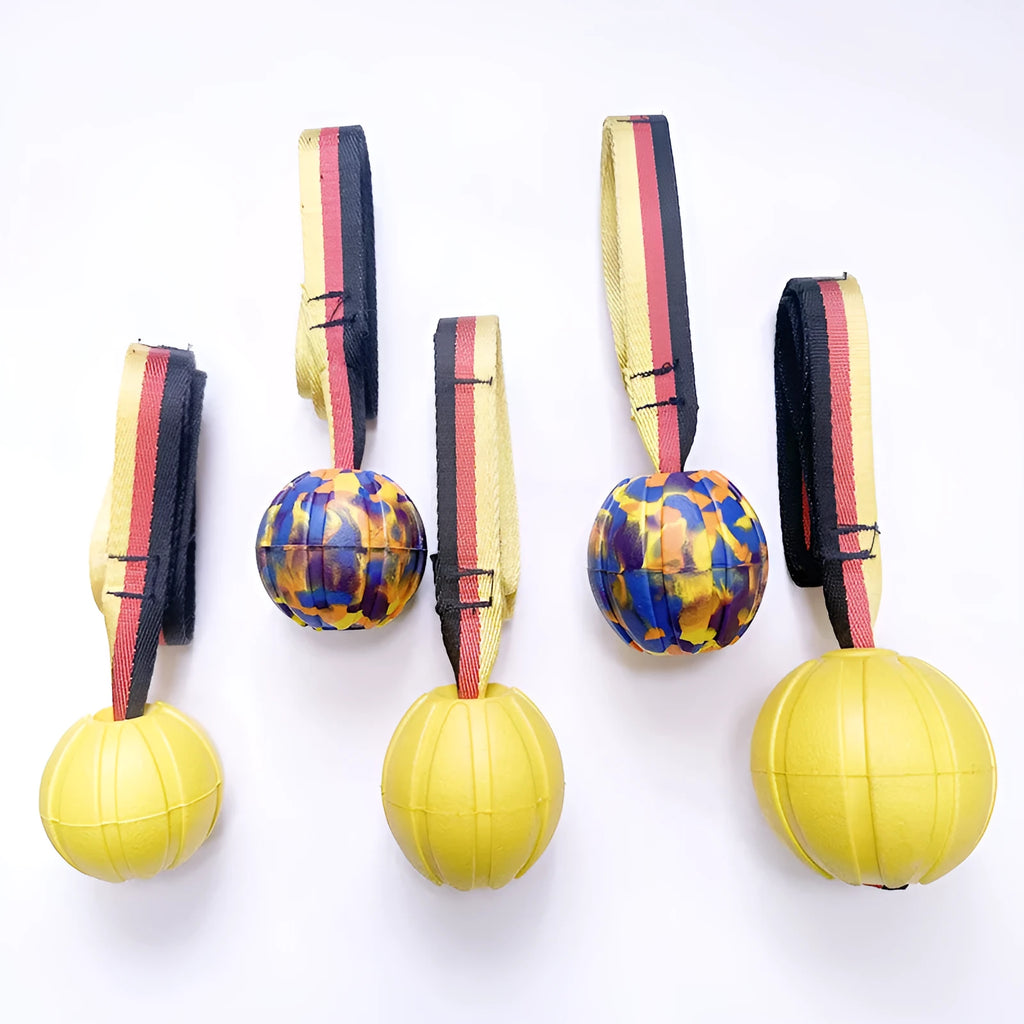Camouflage and yellow EVA floating dog tetherball toys with string in 6.5cm, 7cm, and 9cm sizes.