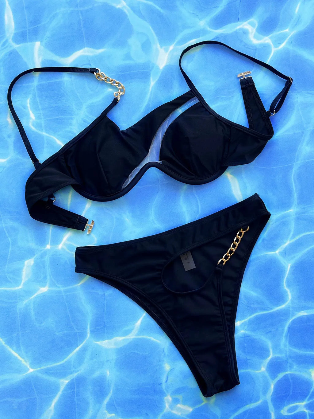 Black women's two-piece hollow split swimsuit with mesh cut-out panels and side ties
