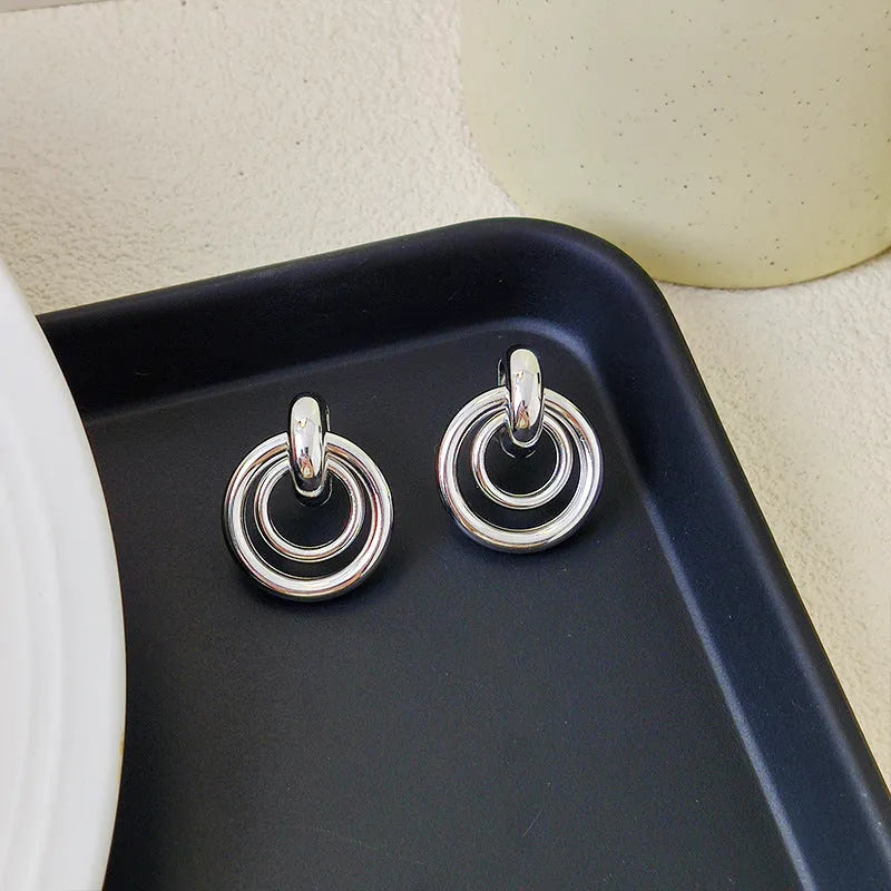 Geometric round ring earrings with irregular design in gold and silver colour options