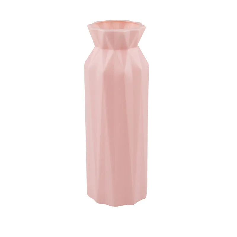 A sturdy green melamine vase with a wide 7.2cm base on a wooden surface.