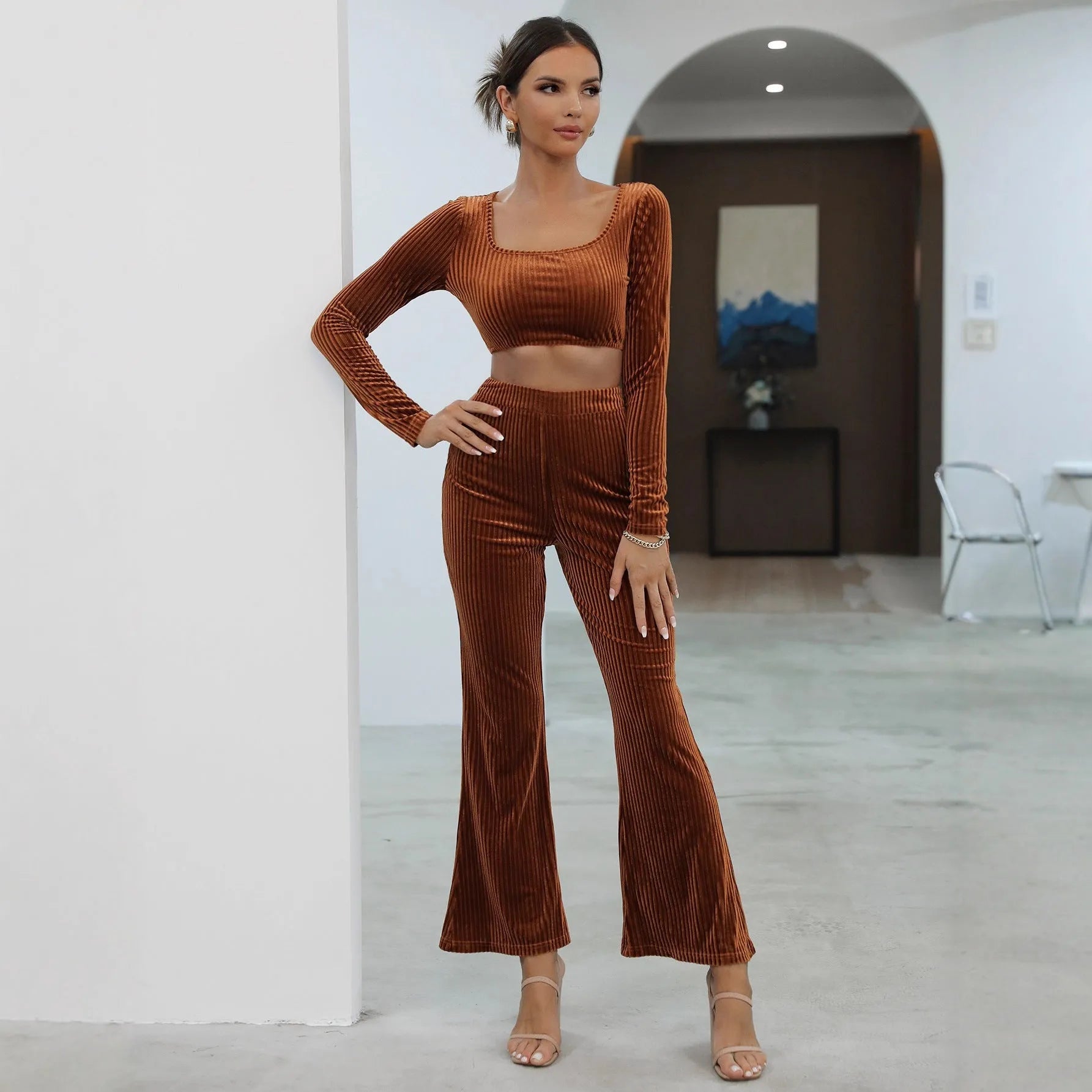 Caramel coloured long sleeve sweater and trouser casual set laid flat