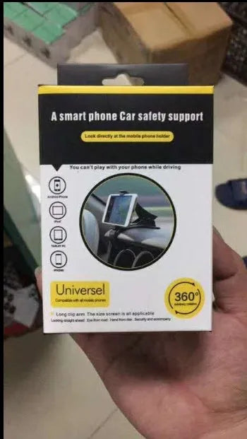 Black G-40 car bracket attached to steering wheel holding a mobile phone for navigation