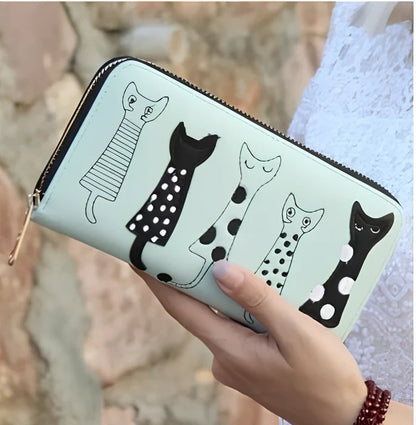 Black women's fashion wallet open showing six card slots and zipped note compartment, 10 cm wide genuine leather