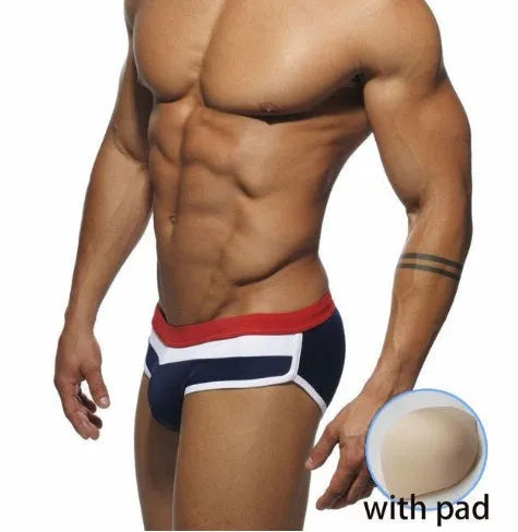 Men's nylon patchwork swim trunks in black with brief cut for swimming