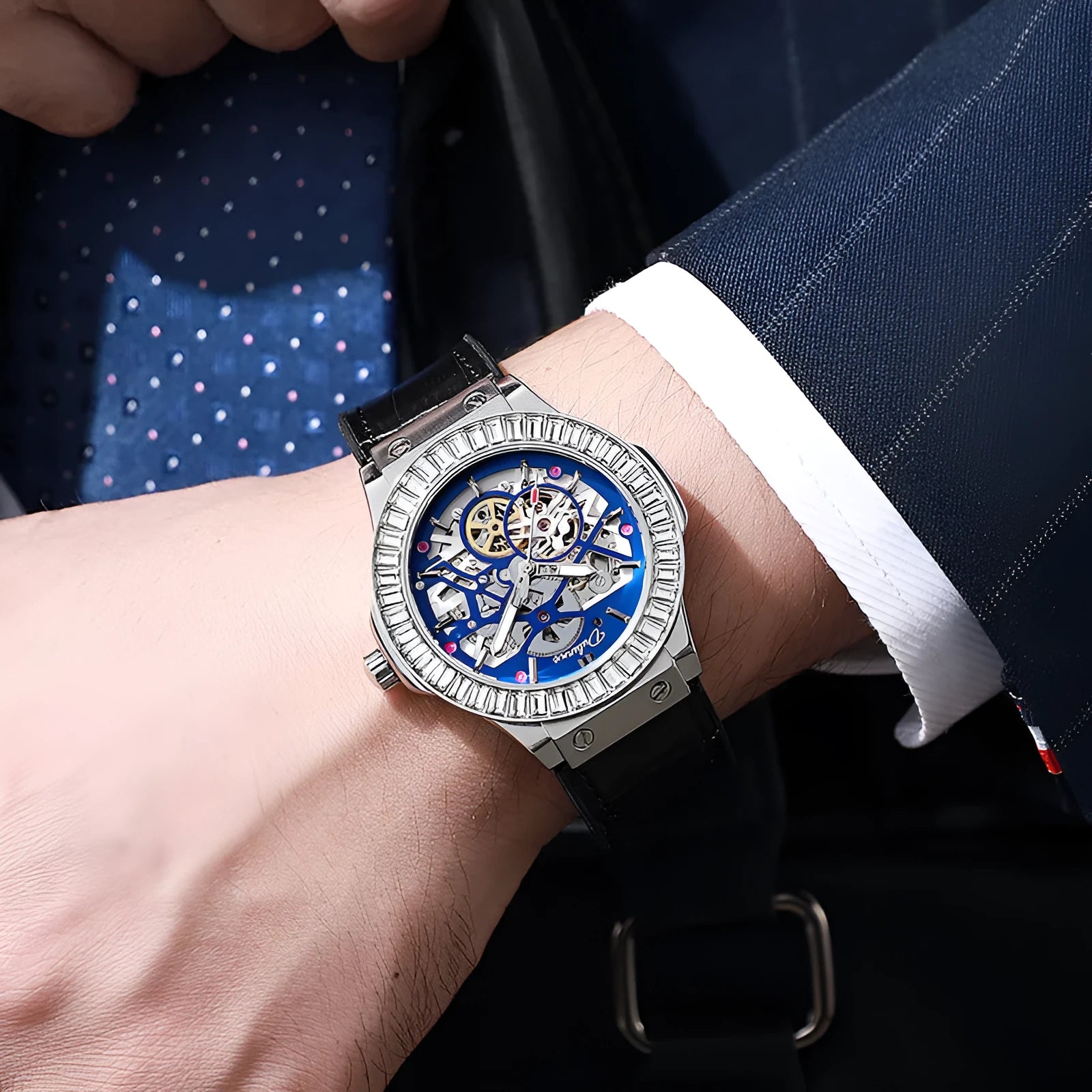 Men's automatic mechanical watch with diamond studs on a hollow dial, shown in a 16mm case.