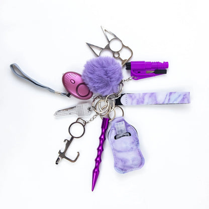 Self-defense keychain set for women with 11 safety tools including alarm, window breaker, and whistle