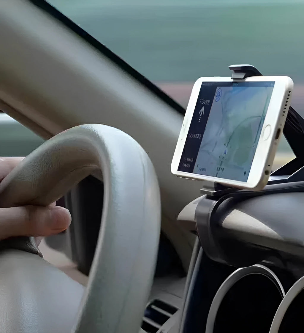 Black G-40 car bracket attached to steering wheel holding a mobile phone for navigation