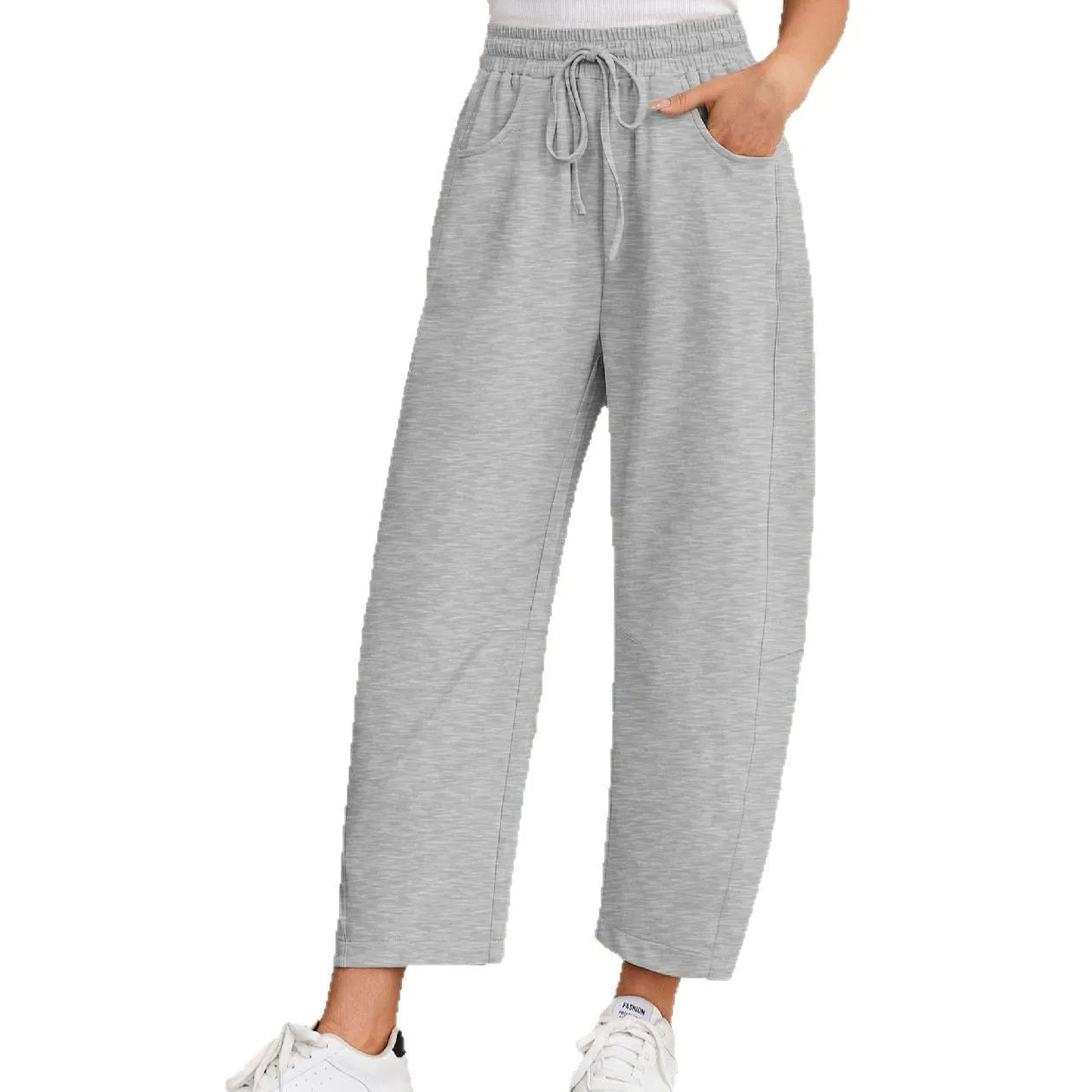 Loose cropped sports sweatpants with elastic waistband and drawstring pockets in street fashion style