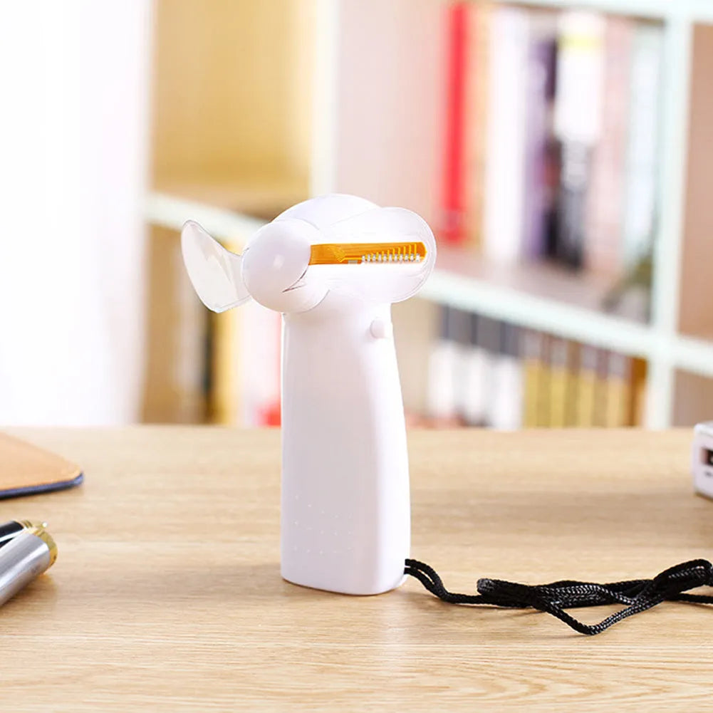 White handheld mini fan with a flashing LED love pattern display.