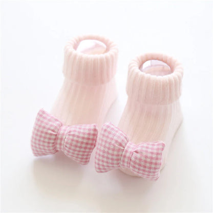 Cotton baby socks in various designs for newborns to 3-month-olds