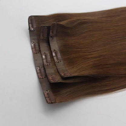 Clip-in human hair extensions in various lengths from 10 to 30 inches with secure attachment clips