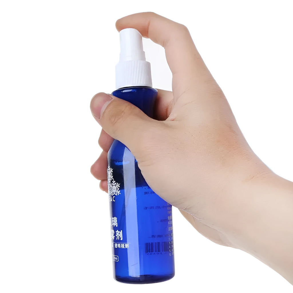 Blue bottle of windscreen liquid-spray anti-fog agent 100 ml on car dashboard