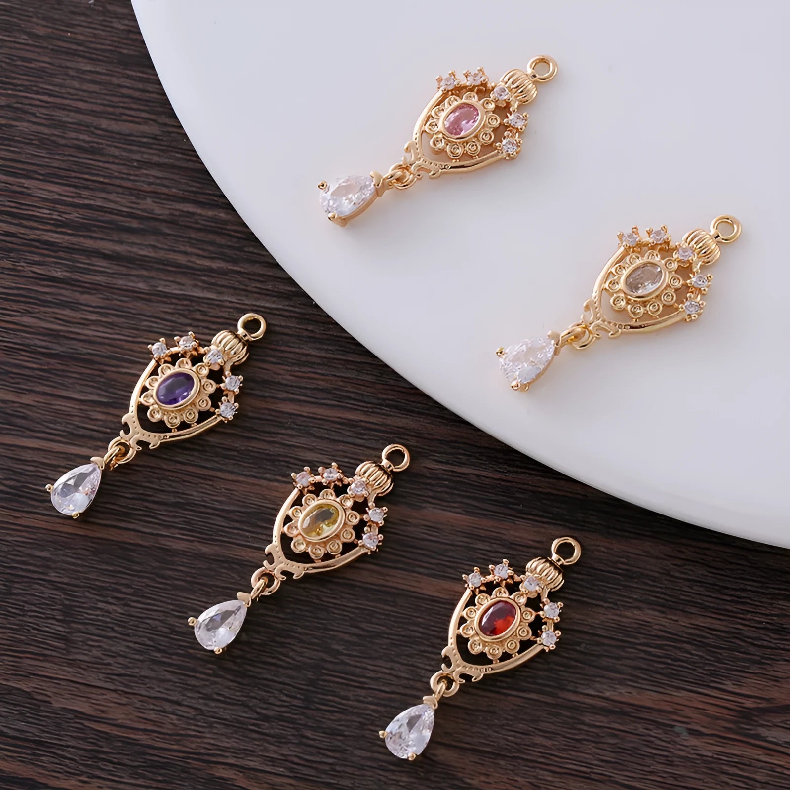 Copper water drop pendant with hollow crown design and zircon details in assorted colours.