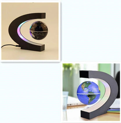 Magnetic levitation globe floating above base with LED light on