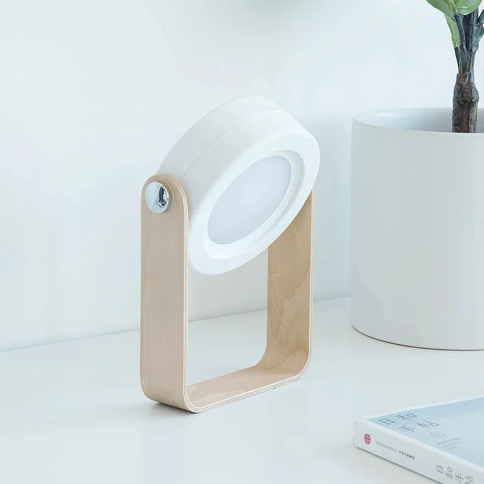 Foldable touch dimmable LED reading lamp in white, showing table lamp and lantern modes.