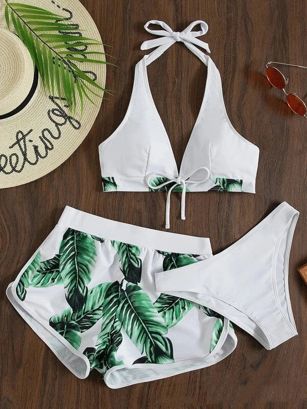 Chic leaf-patterned women's swimsuit set with bikini top, bottoms, and matching shorts in various vibrant colors