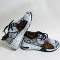 Women's suede sneakers with a wedge heel in various colours on a white background.