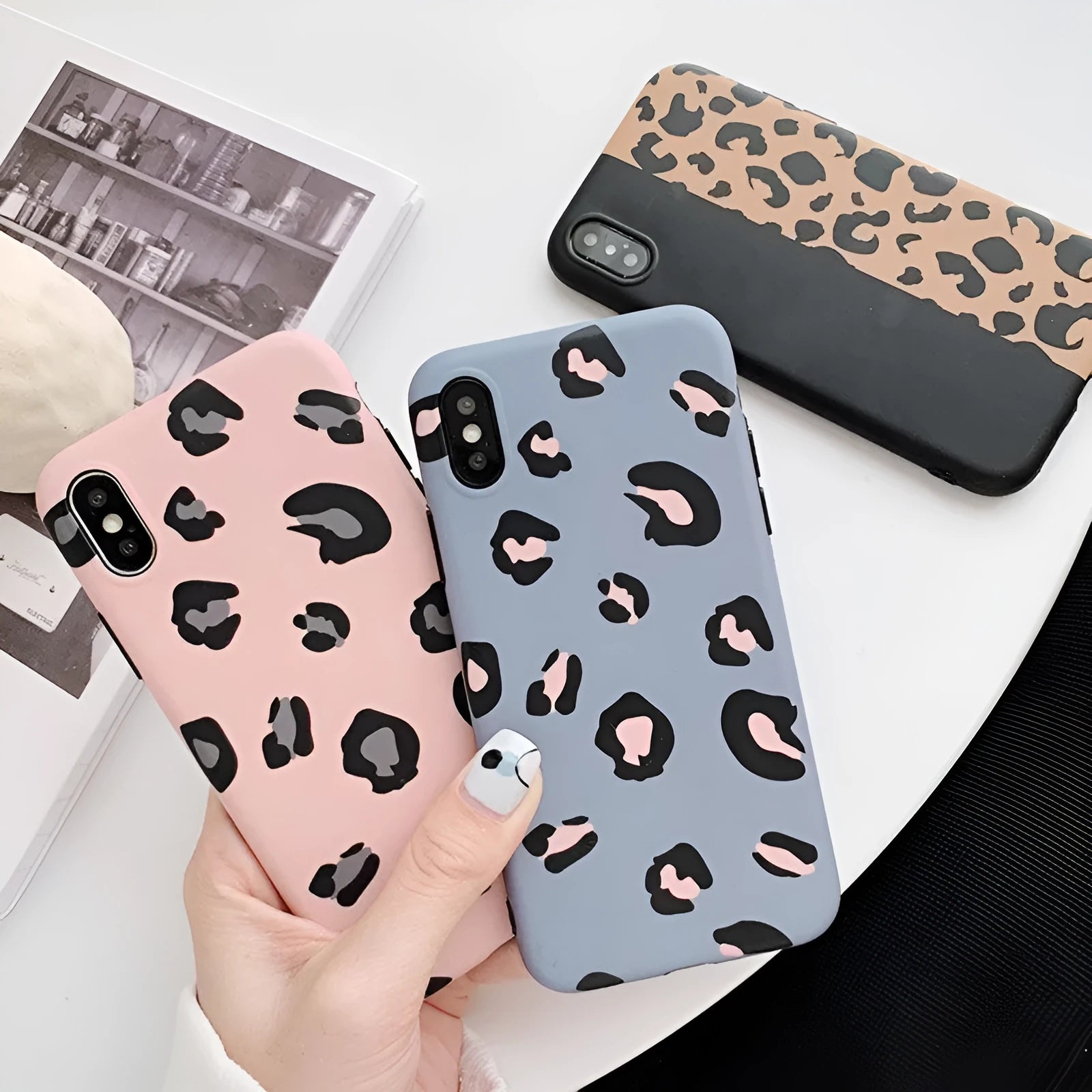 Leopard print iPhone phone case shown in black, blue, and pink colour options.