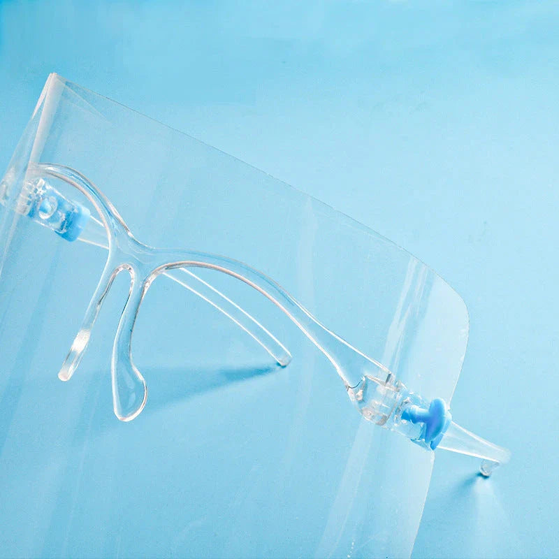 Head-mounted anti-fog and anti-spray mask in blue, green, and pink with replaceable lenses